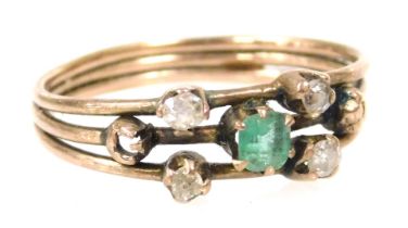 An early 19thC emerald and diamond five stone ring, set in a rose metal triple band, size K, 1.6g al