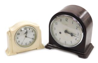 An early 20thC Enfield brown bakelite cased mantel clock, circular silver dial bearing Arabic numera