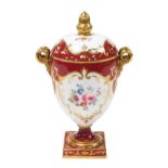 An early 20thC Wedgwood porcelain twin handled vase and cover, of footed ovoid form, with twin gilt