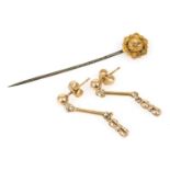 A pair of drop earrings, yellow metal stamped 9ct, 1.5g, and a 15ct gold and diamond set stick pin.