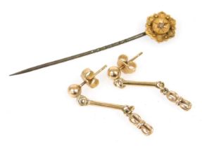 A pair of drop earrings, yellow metal stamped 9ct, 1.5g, and a 15ct gold and diamond set stick pin.