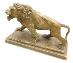 After Antoine Louis Barye (French, 1795-1875). Gilt plaster model of a walking lion, raised on a rec