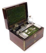 A Victorian rosewood and brass bound toilet set, with cut glass and plate lidded boxes, jars and man