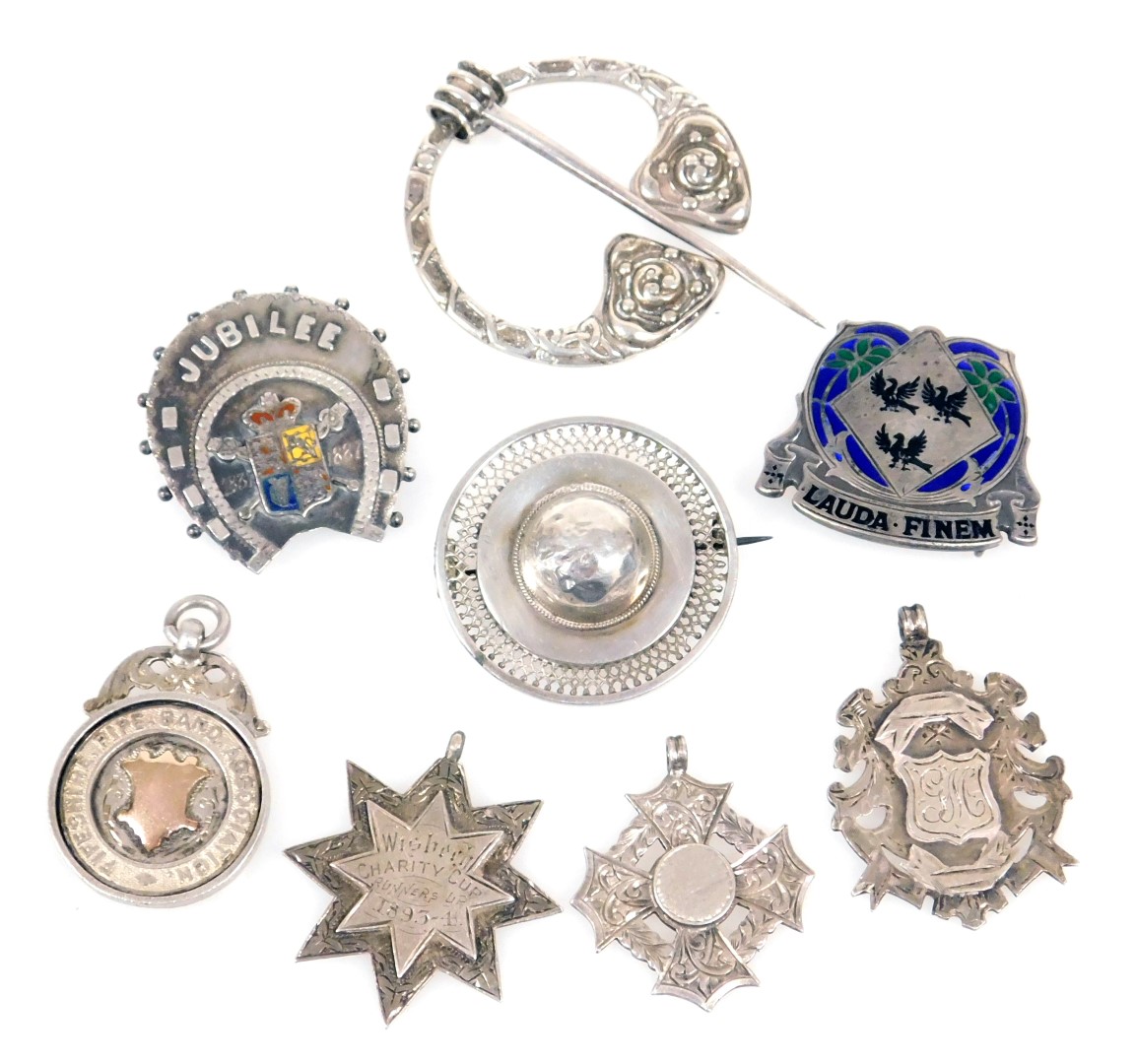 Victorian and later silver brooches and medallions, including a silver and enamel buckle with moto "