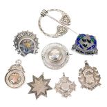 Victorian and later silver brooches and medallions, including a silver and enamel buckle with moto "