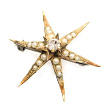 A Victorian 9ct gold diamond and seed pearl star brooch, of six pointed form, 3.4g all in.