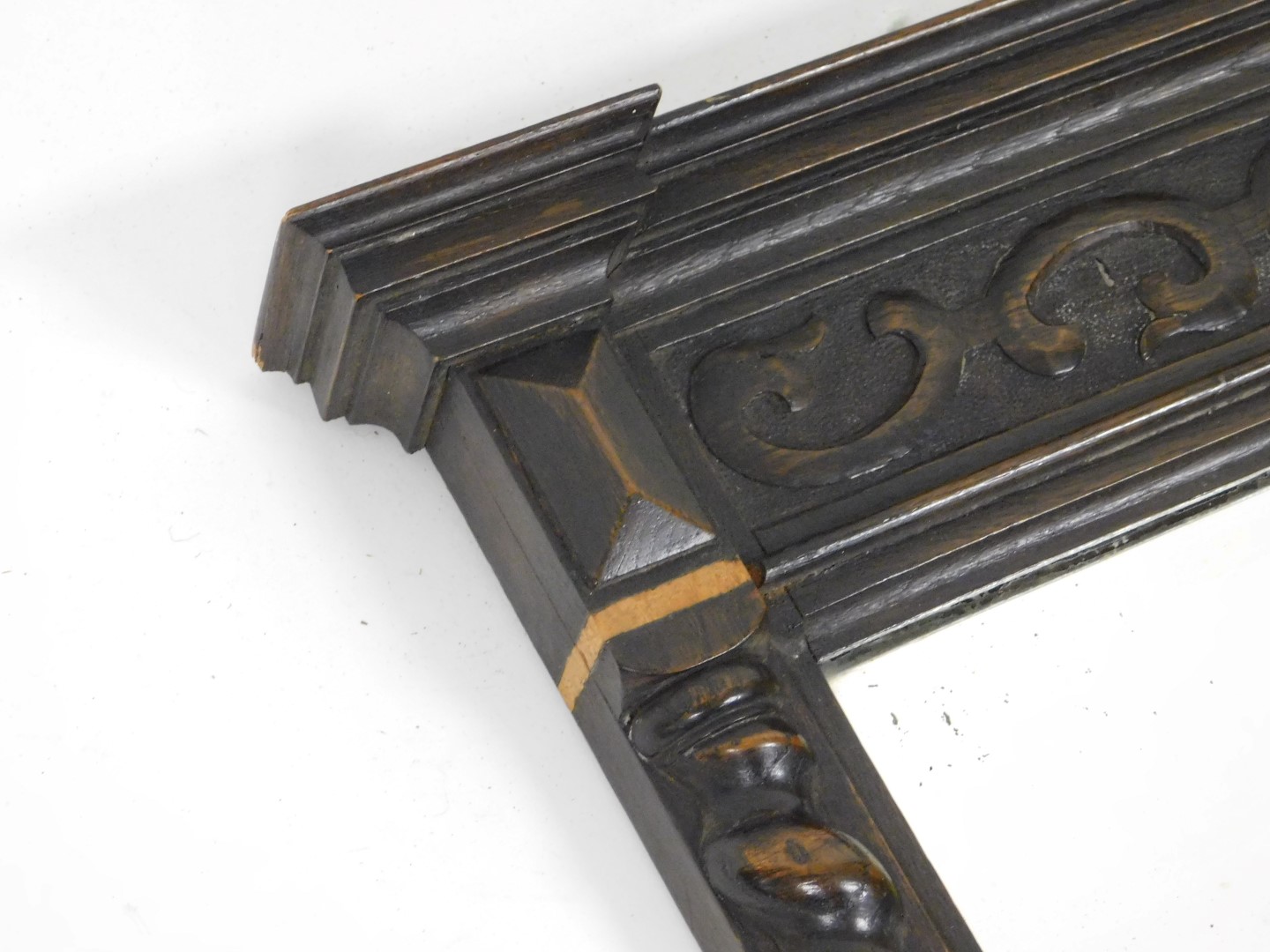 A 1920s oak wall mirror, inverted break front, moulded cornice above blind fret frieze and a bevelle - Image 4 of 4