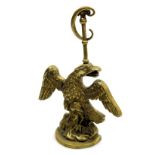 A late 19thC loaded brass doorstop, cast as an eagle, 29cm high.