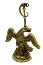 A late 19thC loaded brass doorstop, cast as an eagle, 29cm high.