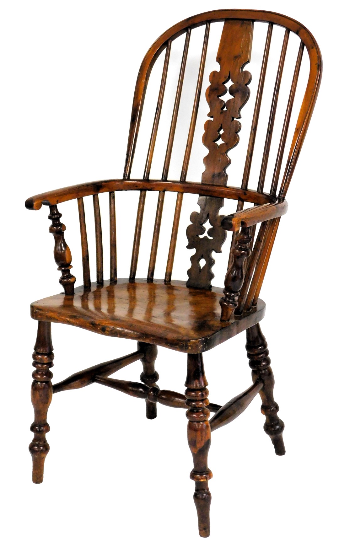 A yew and elm Windsor chair, with a pierced splat, spindle turned rails and a solid seat, on turned