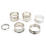 Six silver napkin rings, variously decorated, 3.55oz.