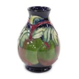 A Moorcroft pottery Apples pattern vase, of baluster form, decorators initials CB, painted and impre