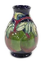 A Moorcroft pottery Apples pattern vase, of baluster form, decorators initials CB, painted and impre