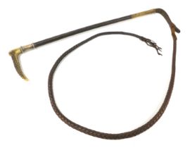 A leather riding crop, with an antler handle, and silver feral, indistinctly hallmarked, shaft 47.5c