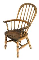 A 19thC ash and elm child's Windsor chair.
