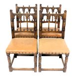 A set of four oak dining chairs, in 16thC style, each back with three arches and turned finials, abo