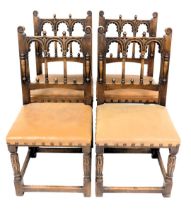 A set of four oak dining chairs, in 16thC style, each back with three arches and turned finials, abo