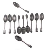 A group of Georgian pewter dessert spoons, with shell capped bowls, the handles initial engraved. (1