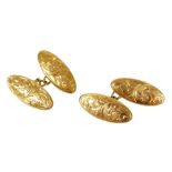 A pair of 9ct gold double oval and chain link cufflinks, with foliate engraving, 2.4g.