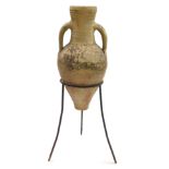 A Roman type pottery amphora in a cast iron frame, 67.5cm high.