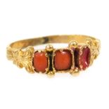 A Victorian coral three stone ring, one stock lacking, in yellow metal, size N, 1.7g all in.