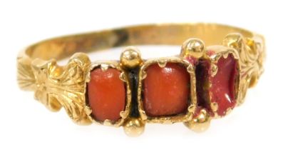 A Victorian coral three stone ring, one stock lacking, in yellow metal, size N, 1.7g all in.