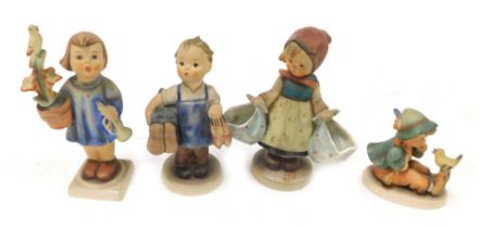 Four Hummel pottery figures, comprising Congratulations, Boots, Mothers' Darling, and Singing Lesson