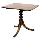 A 19thC tilt top supper table, with rectangular top, on a turned column, tripod base, the top 43cm x