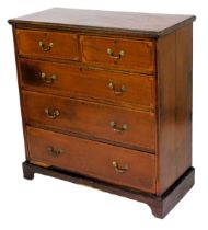 An Edwardian mahogany chest, of two short and three long graduated drawers, with herringbone banding