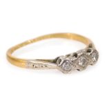 An 18ct gold platinum and diamond three stone ring, in an illusion setting, size J, 1.6g all in.