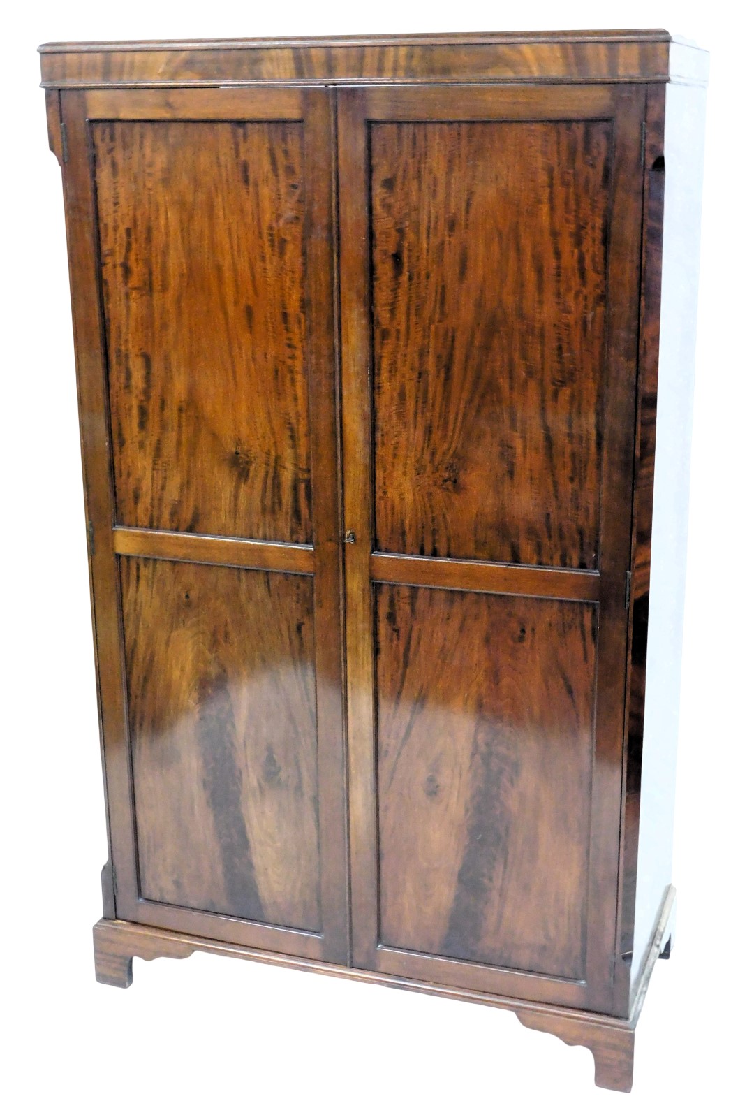 A mahogany wardrobe in George III style, with two panelled doors, on bracket feet, 179cm high, 108cm