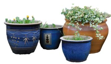 A stoneware garden planter, with scrolling patera border, 35cm high, 50cm diameter, and three furthe