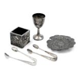 An Edward VII silver bottle holder, with embossed decoration of birds, flowers and foliate scrolls,