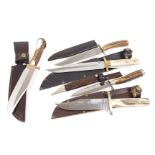 A group of hunting knives, with ceramic or antler handles, with leather sheaths. (5)