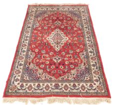A Persian design rug, with central red ground gul, beige and grey borders, 195cm x 130cm.