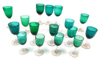 A group of Edwardian green wine glasses, various sizes. (16)