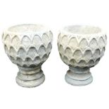 A pair of concrete circular garden urns, decorated with a repeating leaf pattern, 37cm wide.