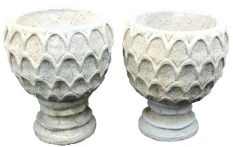 A pair of concrete circular garden urns, decorated with a repeating leaf pattern, 37cm wide.