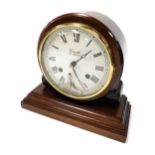 A Comitti of London mahogany cased mantel clock, circular dial bearing Roman numerals, eight day mov