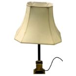 A brass column table lamp, on a square base with cream shade, 71cm high.
