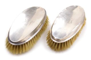 A pair of George V silver backed hair brushes, monogram engraved, Birmingham 1919.