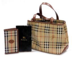 A Burberry handbag, with a zip central and two flanking divisions, 37cm wide, together with a Burber