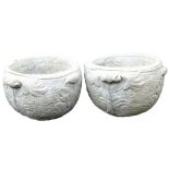 A pair of concrete circular planters, of twin handled form, with leaf decoration, 47cm wide.