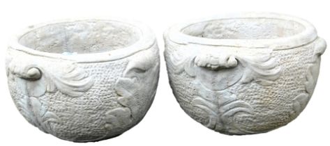 A pair of concrete circular planters, of twin handled form, with leaf decoration, 47cm wide.