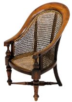 A Victorian tub shaped mahogany and caned child's high chair, on galleried stand with swept legs, 90