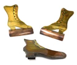 A pair of Victorian copper and brass boot makers ornaments, 11cm wide, and another similar, 14cm wid