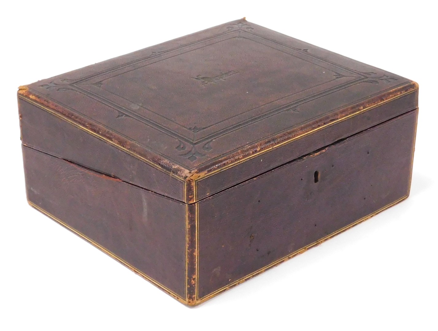 A Victorian Morocco bound writing slope, with tooled and gilt decoration, the hinged lid opening to