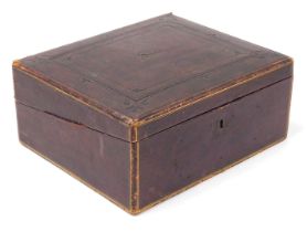 A Victorian Morocco bound writing slope, with tooled and gilt decoration, the hinged lid opening to