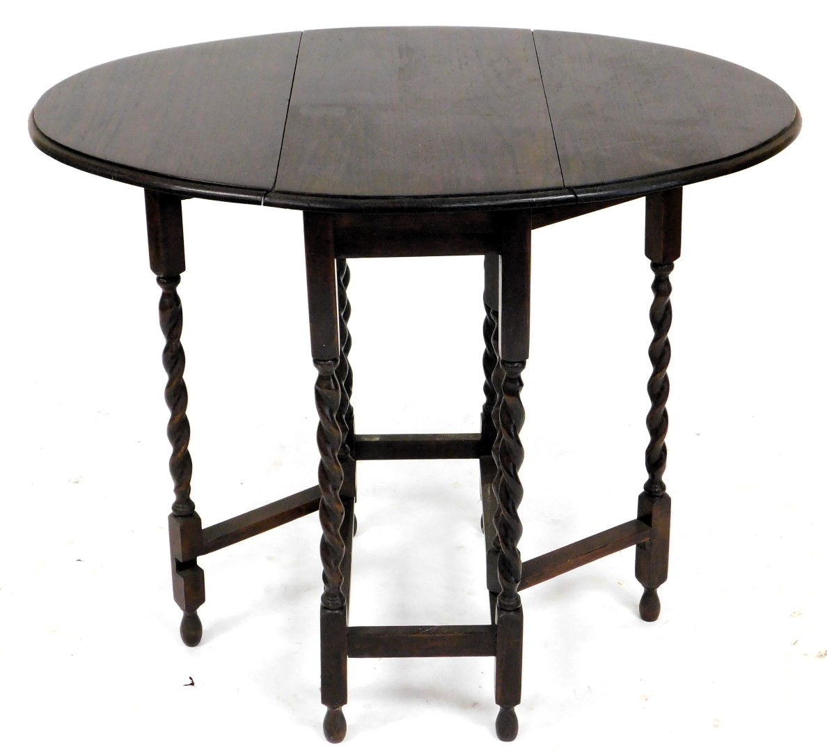 A 1920s oak drop leaf table, with an oval top, on spirally turned supports, 61cm wide. - Image 2 of 2