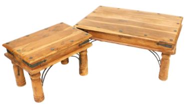 An Eastern hardwood coffee table, with metal mounts, on turned legs, 90cm wide, and a smaller table,